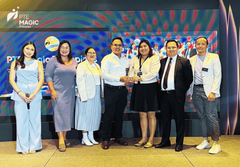 PTE Magic Philippines team receiving the Trailblazer Award on stage at the Pearson PTE Asia Summit